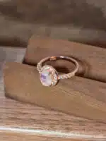 elegant moonstone ring worn on hand, featuring rose gold and crystal shimmer 1 elegant moonstone ring worn on hand, featuring rose gold and crystal shimmer 1